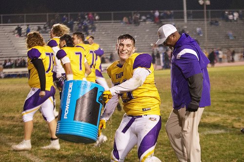 Getting the ice bucket ready after the big win over Frontier High School.